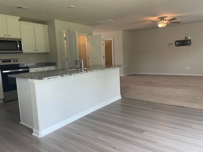 Photo - Spacious 3-bedroom with a massive Owner's Retreat and Dual Closets.