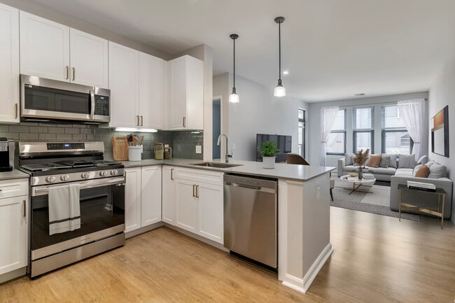 Renovated Package II kitchen and living room with hard surface flooring