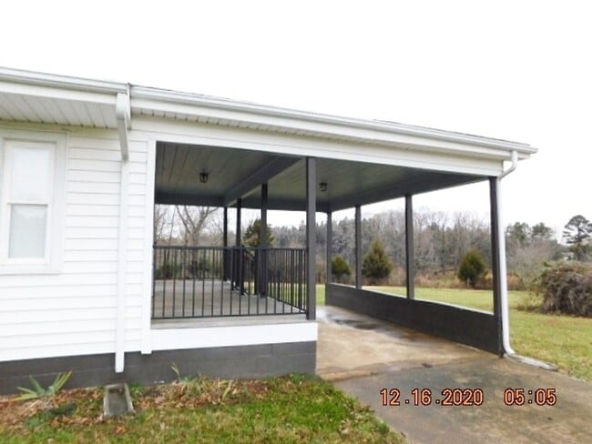 Photo - Home with 2 bedrooms, 1 bath, side deck, carport with side porch and detached garage