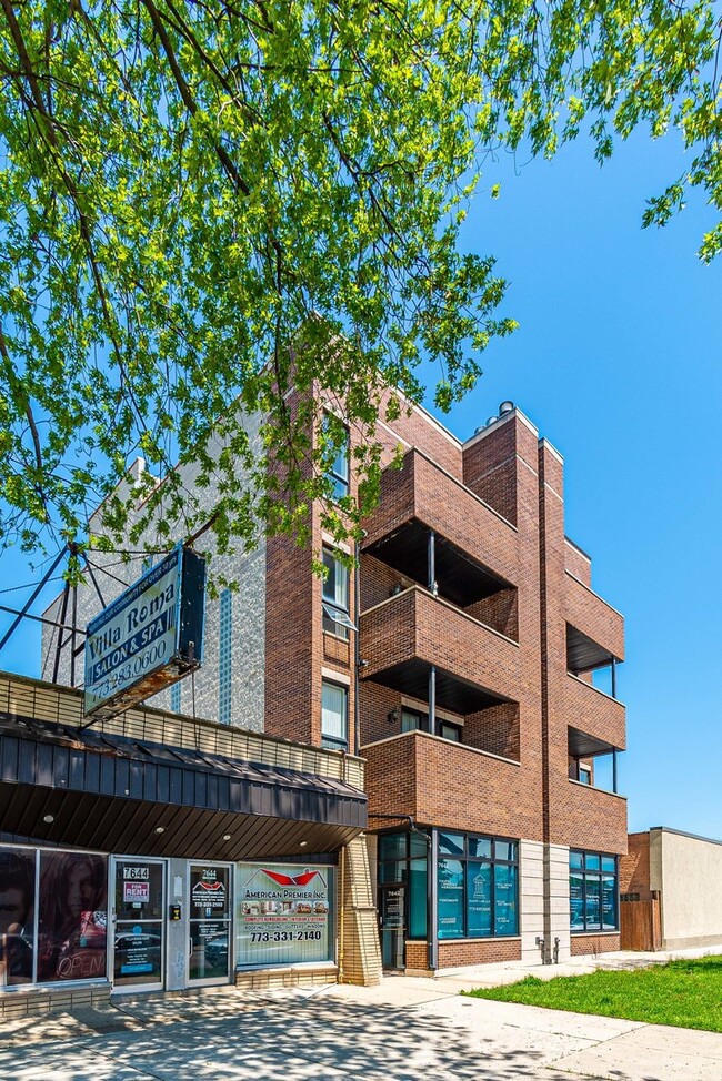 Building Photo - 7642 W Belmont Ave Unit 2