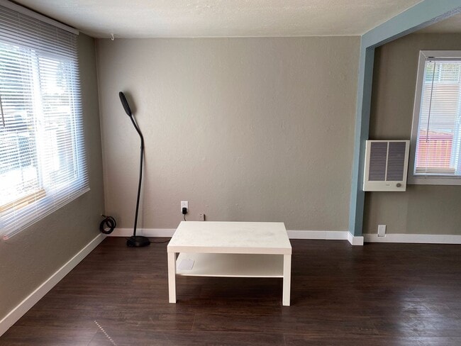 Photo - Little cottage nestled in a street surroun...