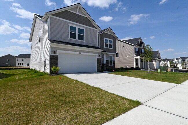 Photo - "Spacious 5-Bedroom Retreat with Luxurious Quartz Countertops & Fireplace on Deerberg Drive!"