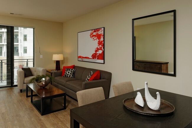 Contemporary dining and living area with hard surface flooring