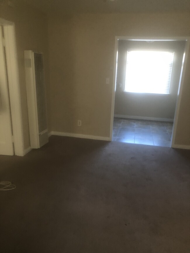 living room to dining area - 1743 N Hollywood Way Apartment Unit 1743