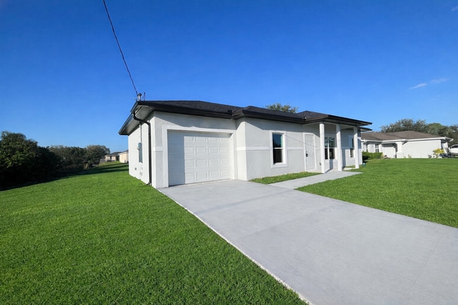 Building Photo - NEW CONSTRUCTION- Modern 3 Bed / 2 Bath Home in Lehigh Acres
