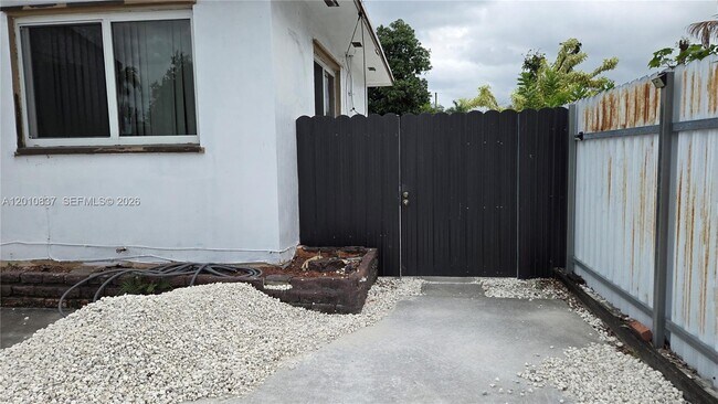 Building Photo - 2440 NW 99th St Unit A