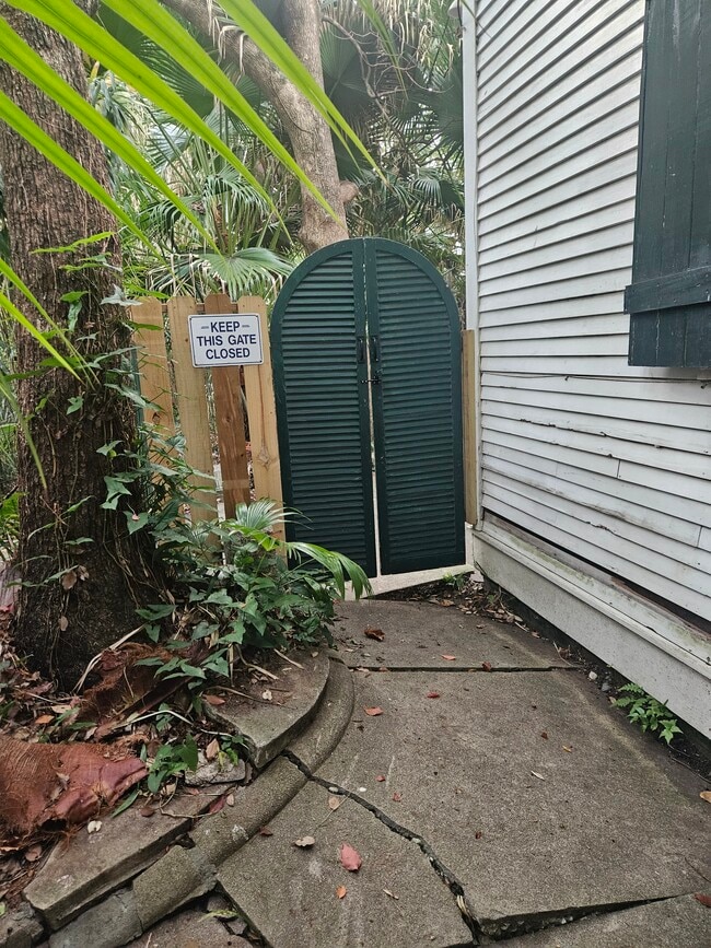 Gate leading to the rear yard. - 2326 Esplanade Ave Unit 2326 Esplanade-Cottage