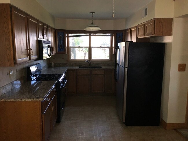 Photo - Affordable Colona Home With 2-Car Garage and Spacious Yard!