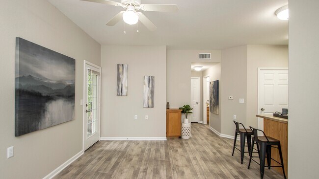 Step into our inviting living spaces with the allure of a French door beckoning you to an intimate outdoor patio.