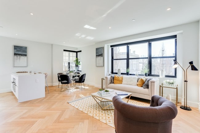 Open living and dining concept with lots of natural light, hardwood floors and Nest temperature control system.