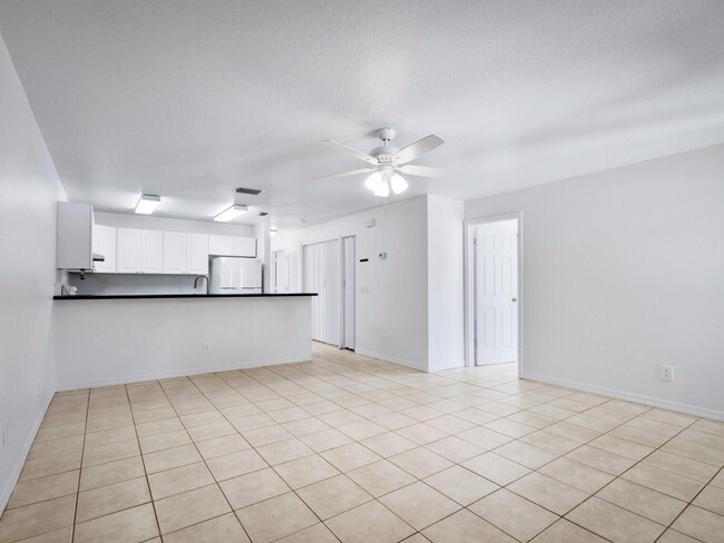 large living room/dining room, open to the kitchen. Pantry & laundry in hallway to the right.
