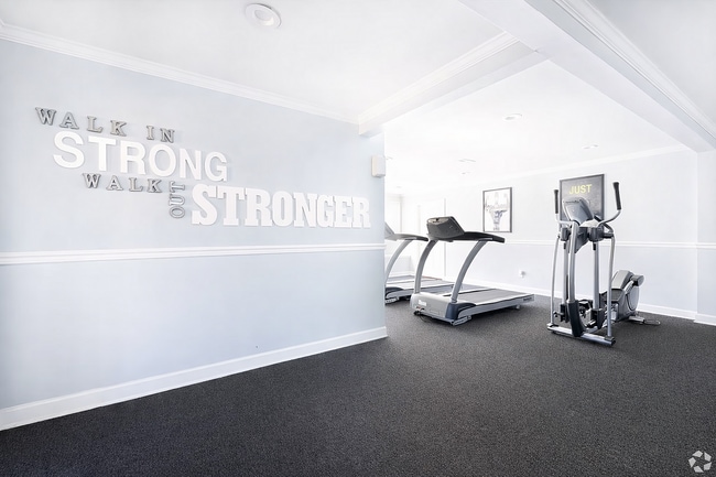 Modern fitness room with motivational decor