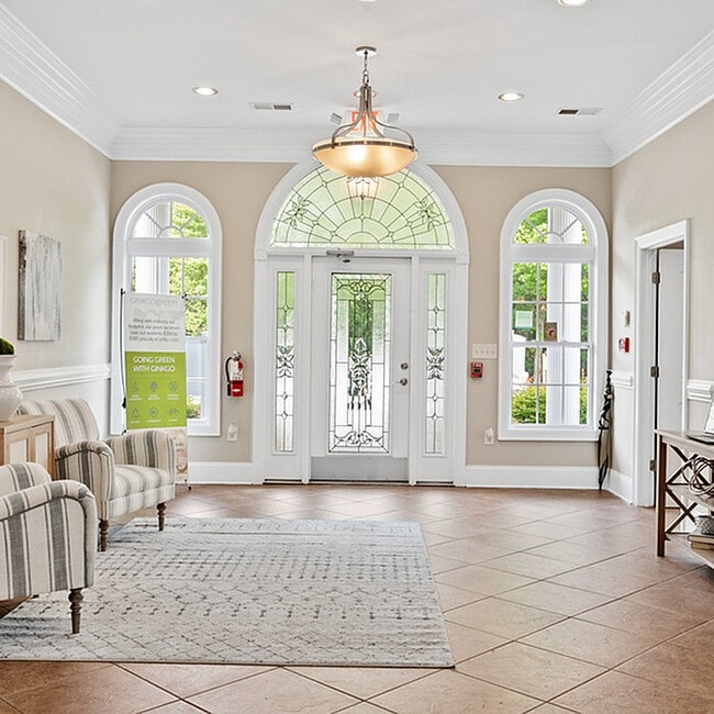 Step into elegance with this beautifully designed foyer featuring ample natural light.