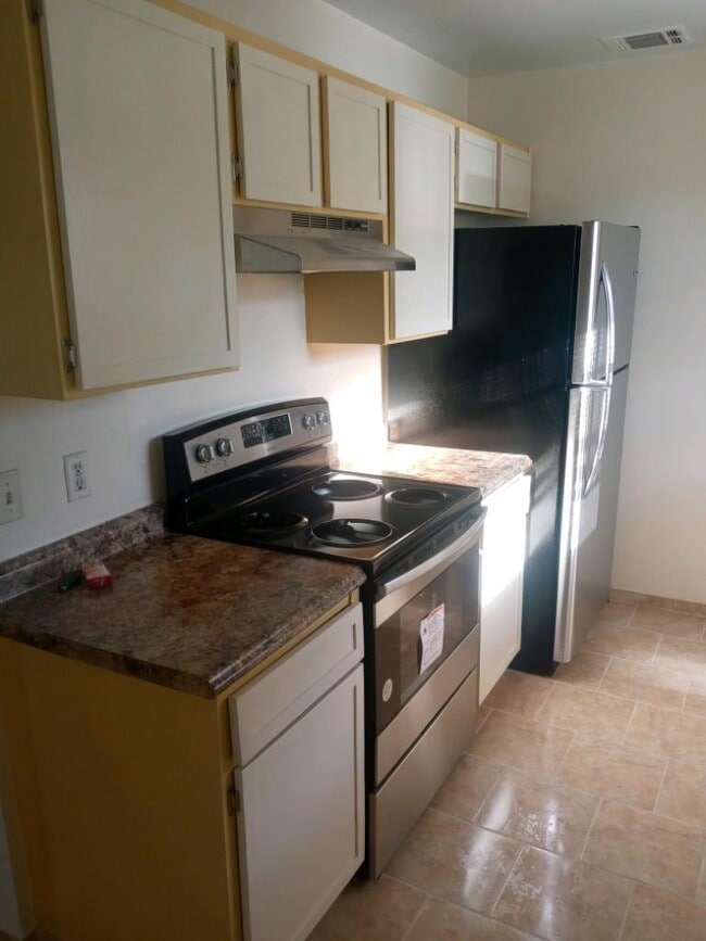 New stainless steel appliances - 120 Lazy Ln Apartments