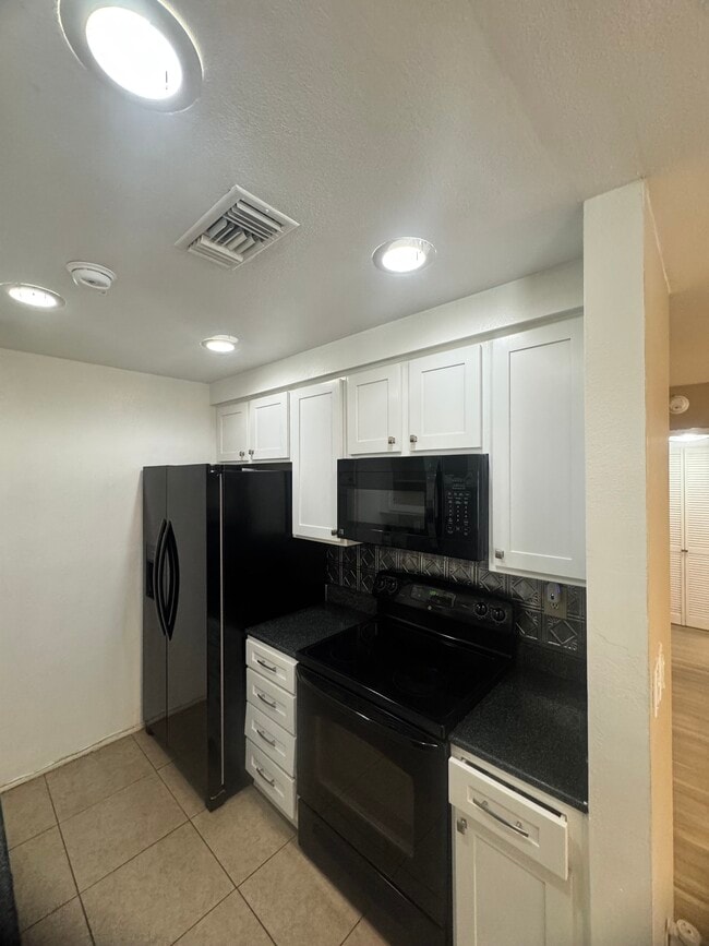 Building Photo - 1745 Neil Armstrong St Unit 102