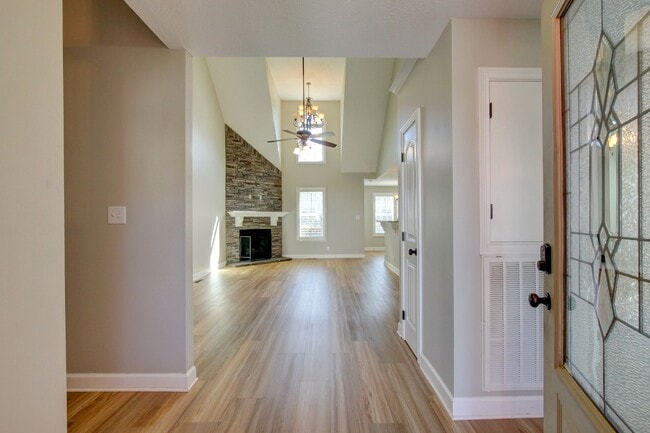 Photo - Fantastic Open Floor Plan Home With Stone Front Fireplace, Stainless Steel Appliances, And Close ...