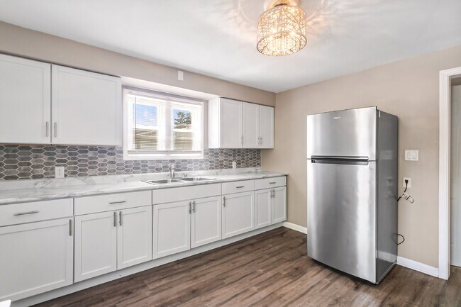 This spacious upper unit features 2 comfortable bedrooms with carpeting
