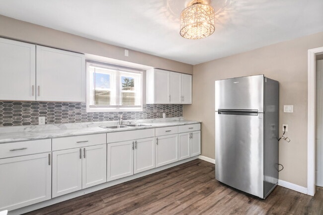 Photo - This spacious upper unit features 2 comfortable bedrooms with carpeting