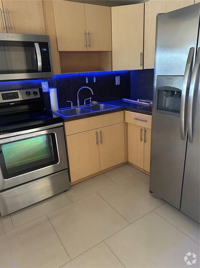 Building Photo - 6095 W 19th Ave Unit 407 Rental