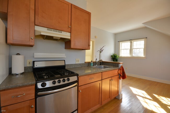 Kitchen with solid wood cabinets & new gas stovend - 103 Jennie Ln Unit Raeside Dame Apartment