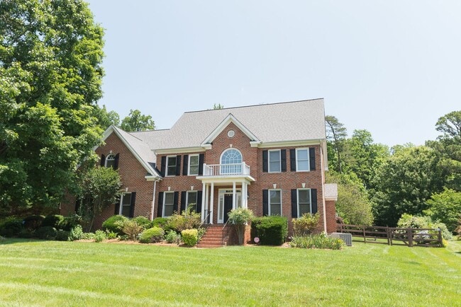 Building Photo - Spacious & Striking 3-story brick Executive 4 bedroom 4.5 bathroom home in Oak Ridge NC + Lawn ca...