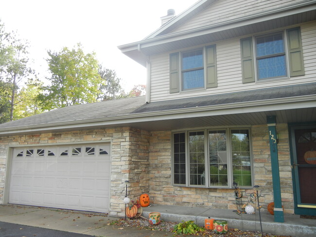 Side of Duplex pictured with 2.5 Car Garage - 120 Hilly Oak Dr Townhome