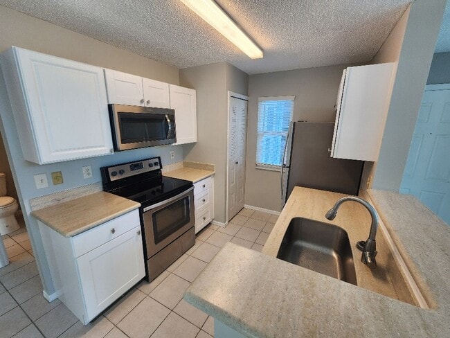 Photo - Remodeled beach condo steps away from the beach!!!