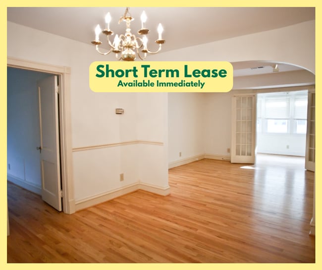 Building Photo - Beautiful condo with sunroom and hardwood floors - Short term lease only!