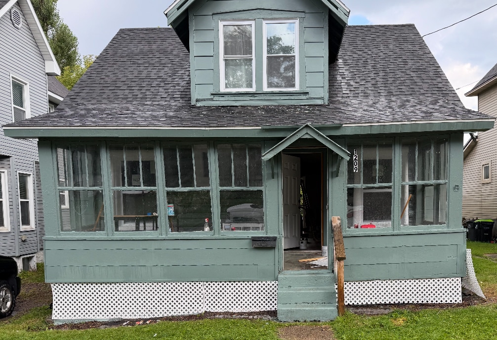 Enclosed porch front and deck in back - 1209 Tweed St House