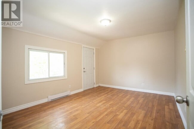 Photo - 2 Bedroom Upper-Level Unit – Parking & In-... Unit B