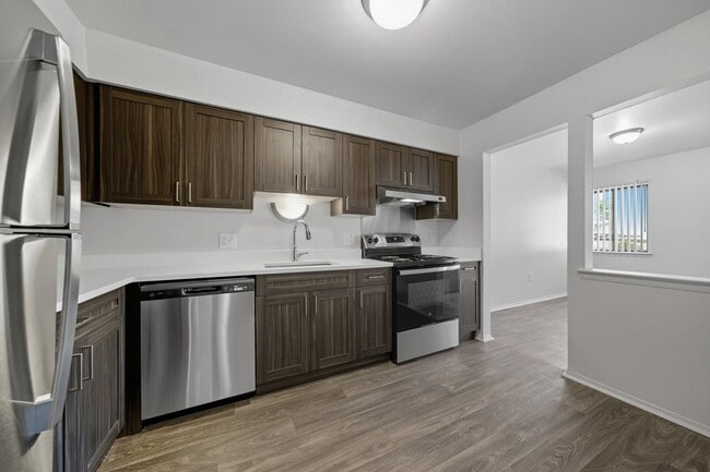 Modern kitchen with stainless steel appliances at Franklin River Apartments in Southfield, MI - Franklin River Apartments
