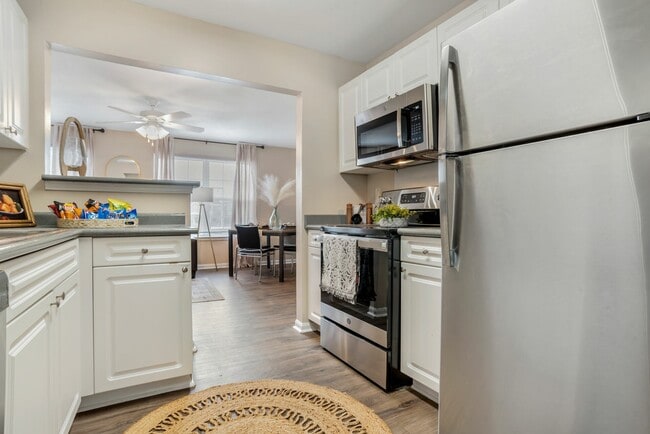 Modern Kitchen with Pass-Through Counter and Stainless-Style Appliances