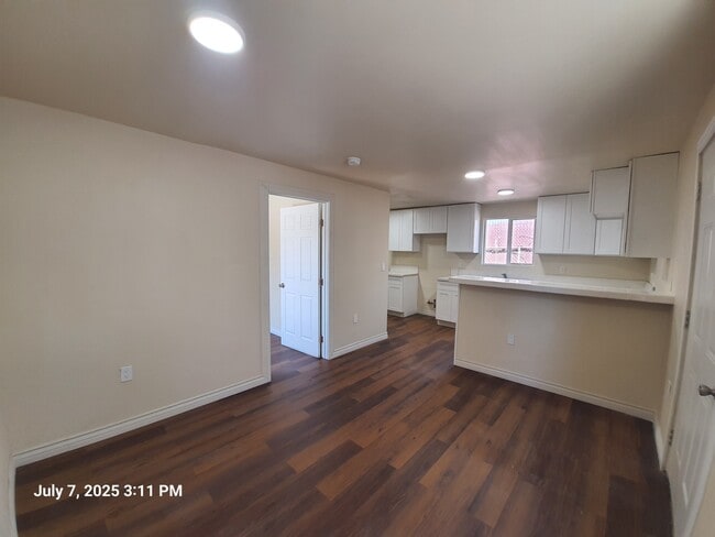 Living room / kitchen - 1221 W 152nd St Apartments