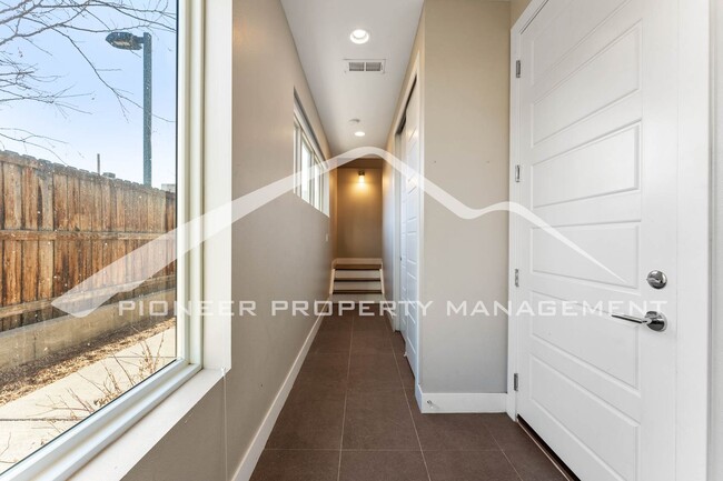 Photo - Fantastic Townhome with A Roof Top Patio, Attached Garage, and Central AC!