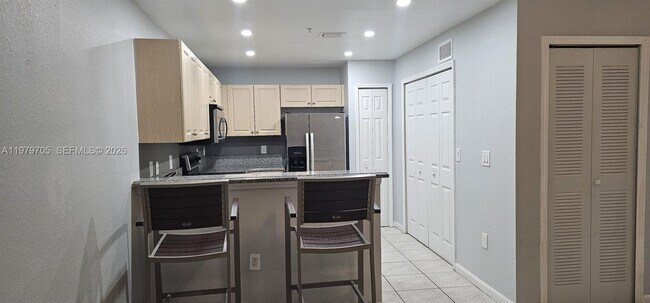 Building Photo - 11002 NW 83rd St Unit 210