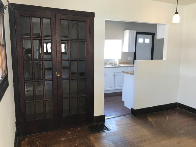 Kitchen and built-in cupboard from living room - 1105 E 8th St