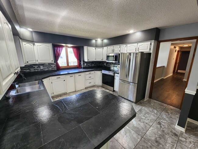 Photo - 2-Car Garage + Washer & Dryer + Recently Updated! Available September 3rd!