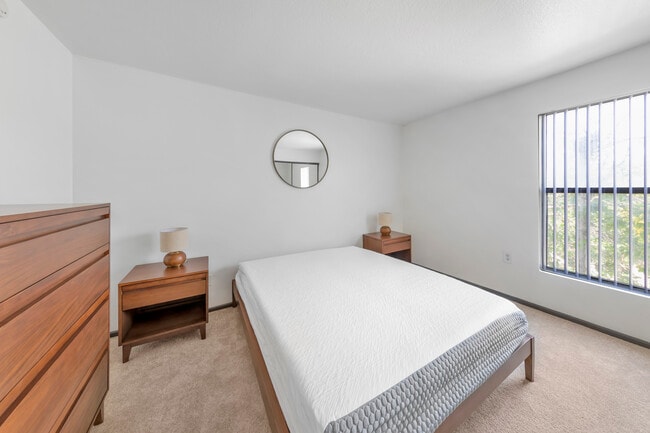 Furnished+ apartment homes feature queen bed with mattress, dresser, nightstands, and lamps (Representative Image – exact items and style of furnishings may vary)