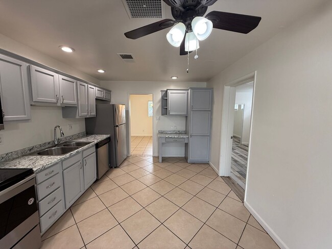 Photo - 4 Bedroom Home with Large Backyard | Modern Landscaping | Utilities Included