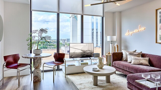 Apartment Living Room with Floor-to-Ceiling Windows and Wood Style Flooring - Griffis West Palm