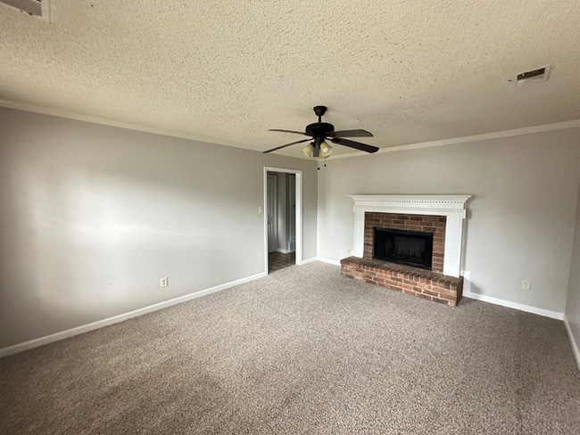 Photo - MOVE-IN READY! 3BR/2BA in Quiet Cove | Brick Fireplace | Fenced Yard & Patio!