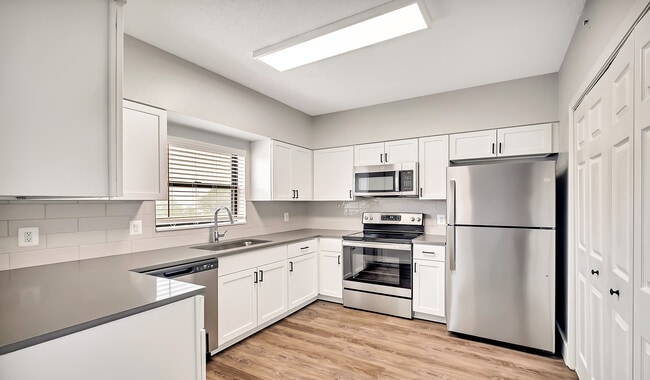Select homes have upgraded kitchens with quartz countertops and wood flooring