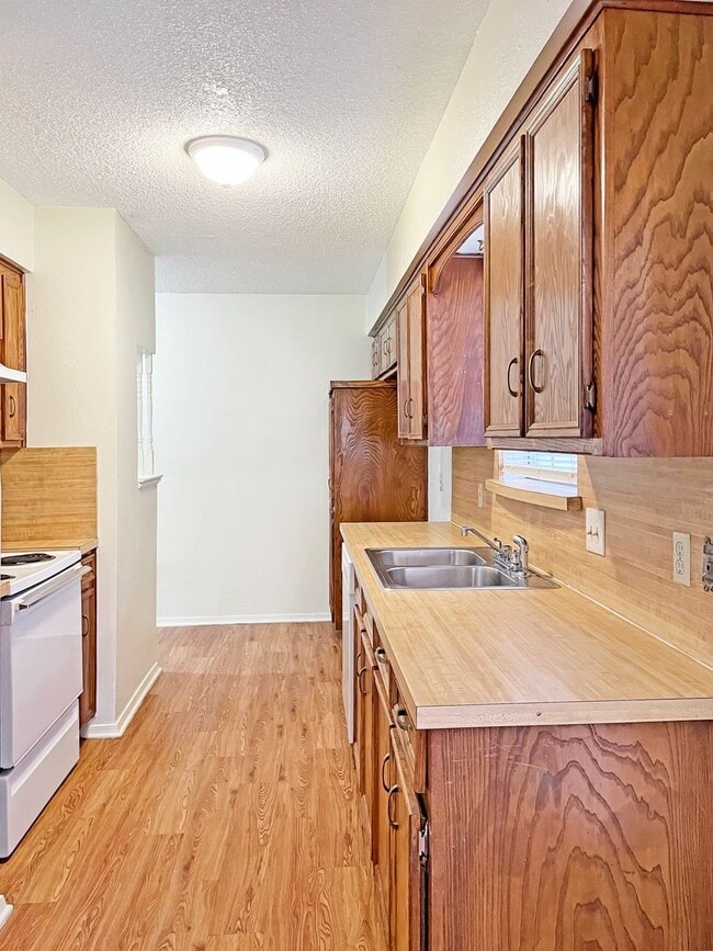 Photo - Spacious 3-Bedroom Duplex with Covered Parking & Fenced Yard!