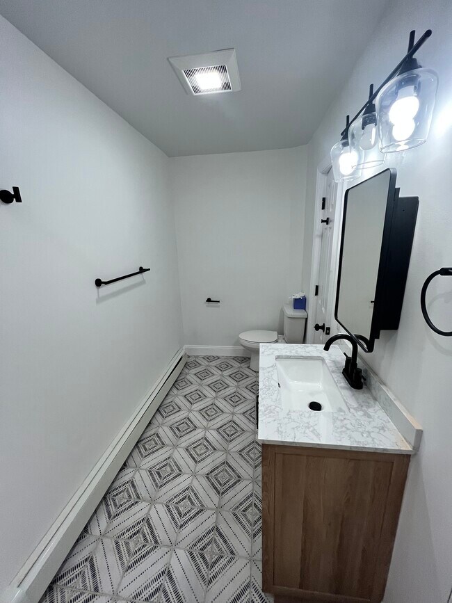 Remodeled bathroom - 24 Center St Unit #1