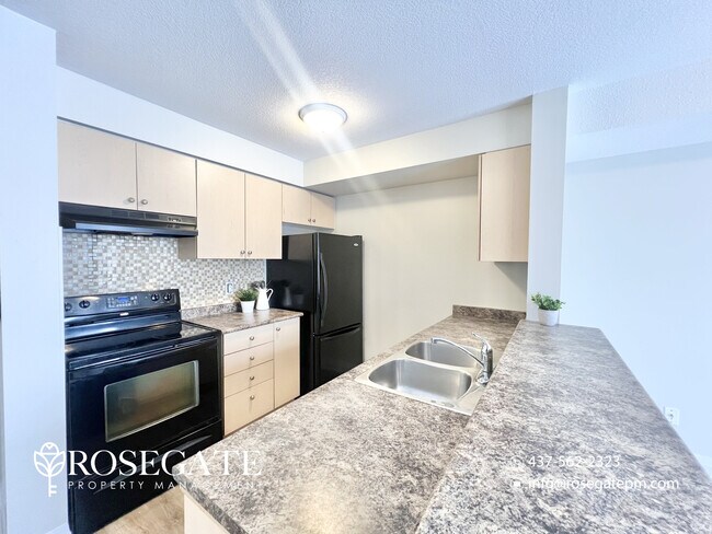 Photo - 3-Bedroom Townhouse with Balcony & Parking in Kitchener Unit 12D