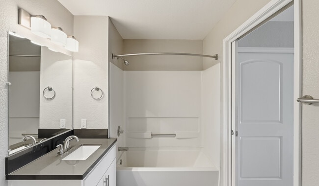 Start and end your day in a bright, modern bathroom designed to match the clean lines and elevated finishes.