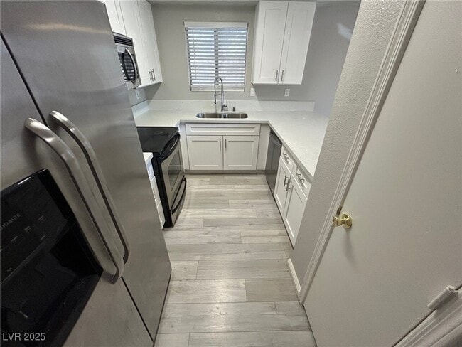 Building Photo - 6871 Tamarus St Unit 204