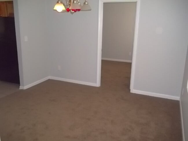 Photo - Freshly painted and new flooring in this 4 Bedroom 2 and Half Bath home. Covered front porch with...