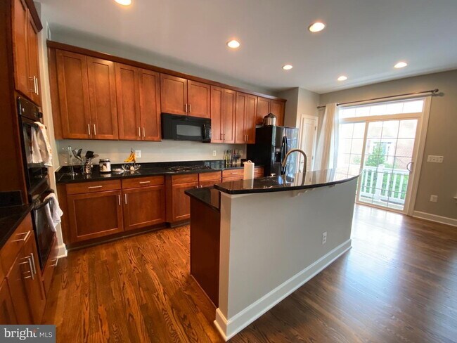 Bright & Spacious End-Unit Townhouse with Two-Car Garage!