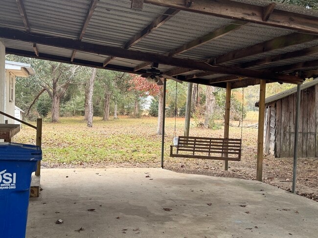Covered porch with swing - 20089 Padgett Rd